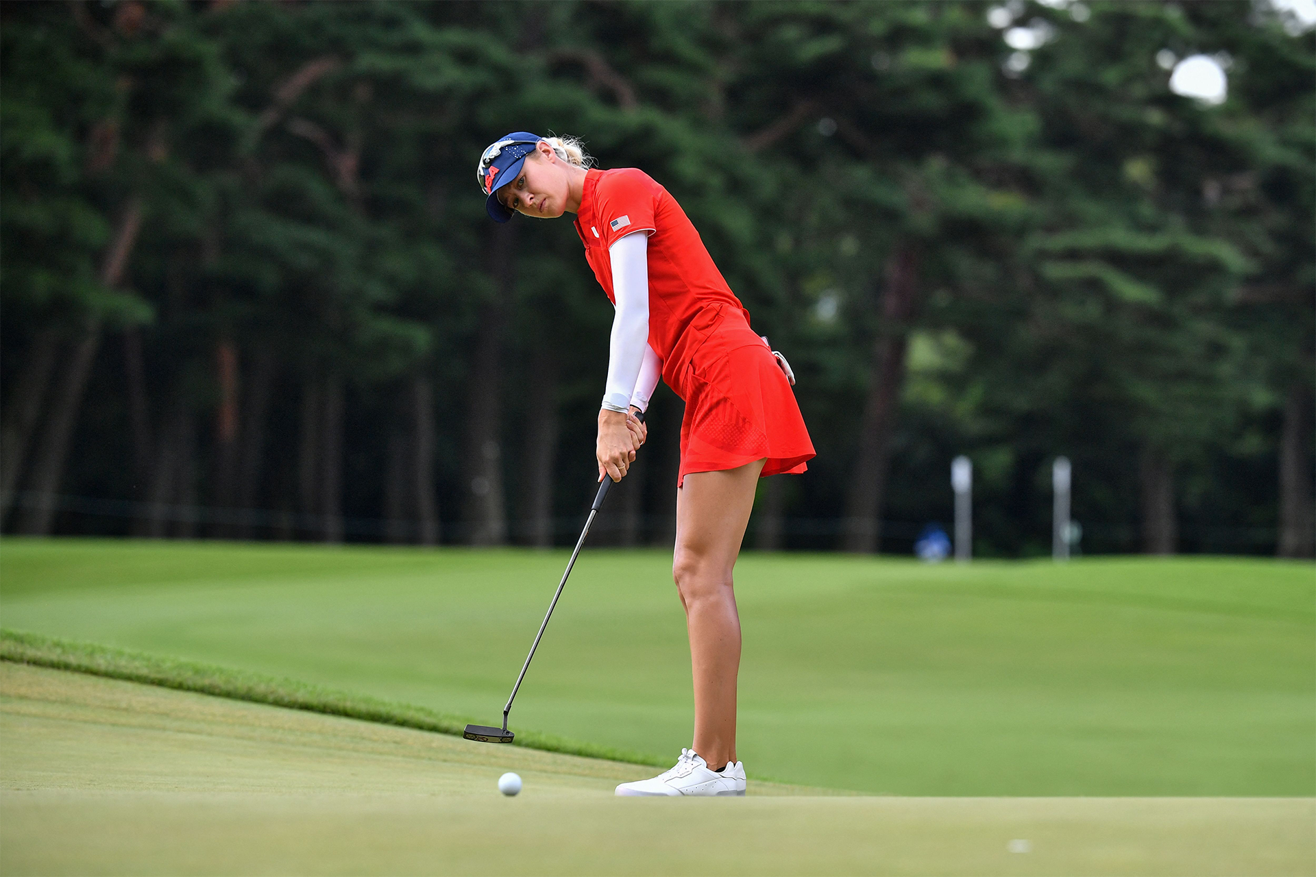 Golfer Nelly Korda lines up a putt. Korda will be going for her sixth consecutive LPGA Tour Win at the Cognizant Founders Cup this weekend on Peacock.