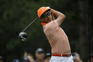 Rickie Fowler swings a drive at the Rocket Mortgage Tournament 2023