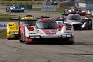 Sports Cars race on a road course in IMSA