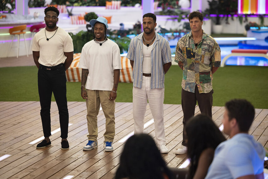 Guys of Love Island USA Season 6 (L to R: Hakeem, Kordell, Kendall, Rob) stand at the front of the firepit.