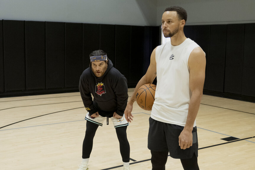 [L-R] Adam Pally and Stephen Curry in Mr. Throwback