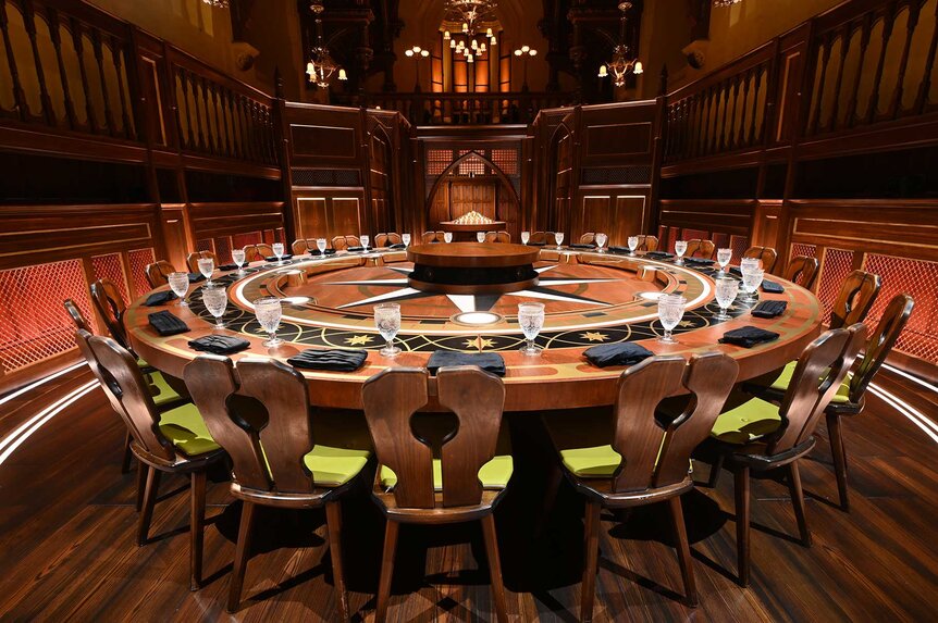 The round table with chairs on The Traitors Season 1 Episode 1.