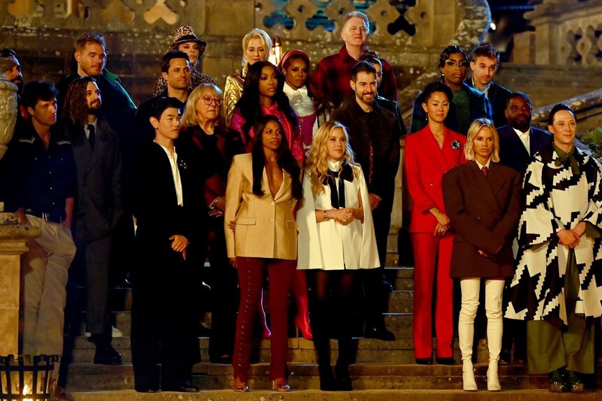 The cast of The Traitors Season 4 stands together.