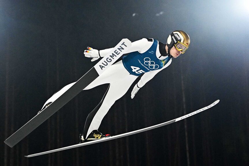 Germany's Philipp Raimund jumps during the men's ski jumping normal hill training ahead of the Milano Cortina 2026 Winter Olympics.