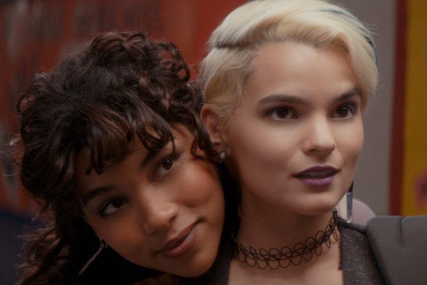 McKayla Hooper (Alexandra Shipp) rests her head on Sadie Cunningham's (Brianna Hildebrand) shoulder in Tragedy Girls (2017).