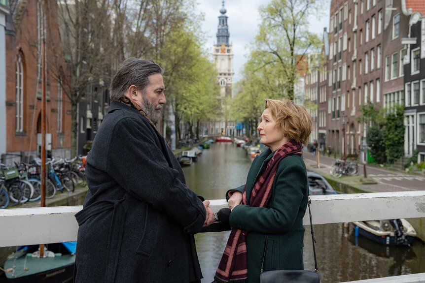 Gerry and Stella holding hands in Midwinter Break (2026).
